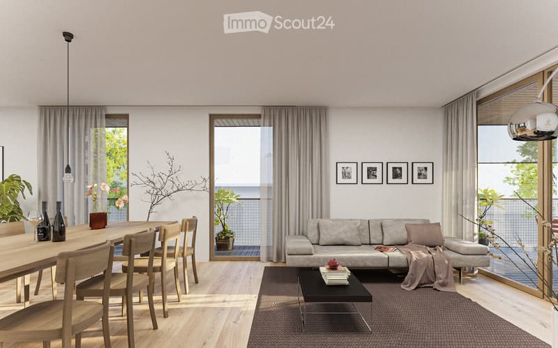 Modern living room with wooden floor, large windows, dining table, and a couch with pillows.