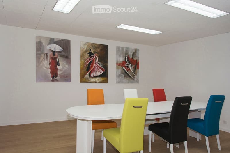dining room, white table, six chairs, white walls, paintings