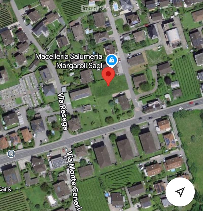 Aerial view of a residential area with multiple houses, green spaces, and roads. The location is marked with a red pin labeled "Maccelleria Salumeria Margaroli Sagl" near Via Resega and Via Monte Generi.