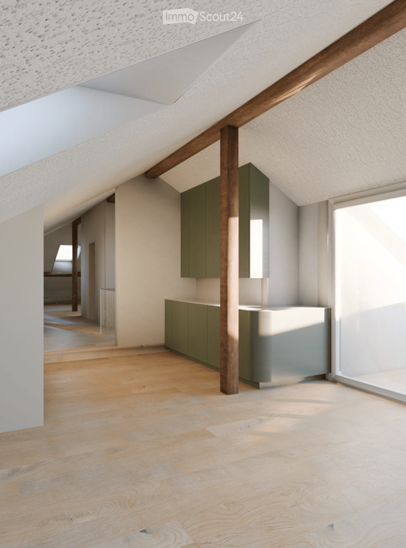 Bright, open attic space with wooden flooring, white walls, and modern green cabinetry. Exposed wooden beams and skylights provide natural light.