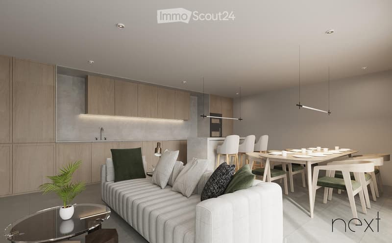 Modern open-plan living and dining area with a grey sofa, coffee table, dining table with chairs, and a small kitchen area with cabinets and a faucet.