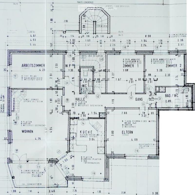 Floor plan of a residential building showing multiple rooms including a kitchen, living room, bedrooms, and bathrooms. Dimensions and room labels are indicated.