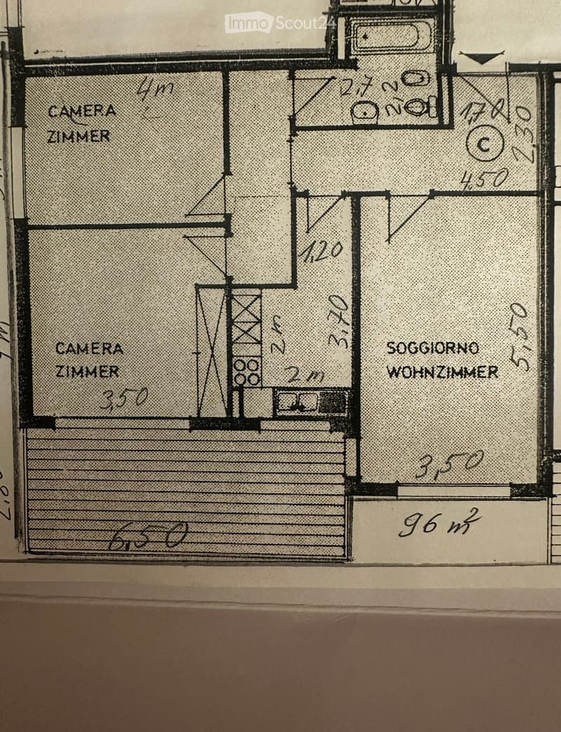 Floor plan showing two bedrooms, a living room, and a bathroom with labeled dimensions in meters.