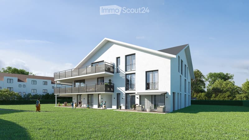 Modern two-story house with white exterior, large windows, and balconies. The house features a spacious lawn in front with outdoor seating and people walking nearby.