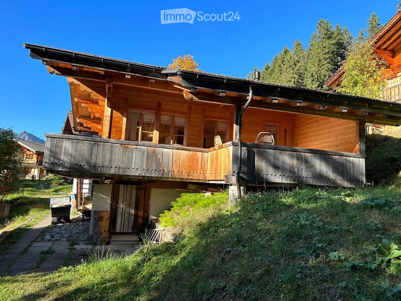 Detached wooden house, wooden balcony, steep terrain, mountain view, two story