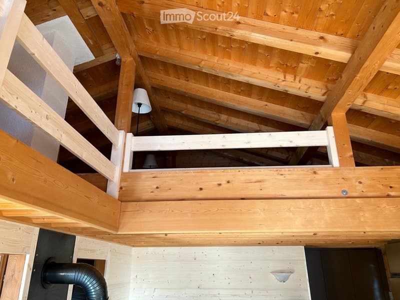 wooden exposed beams ceiling, wooden stairs, lamps, wooden floor