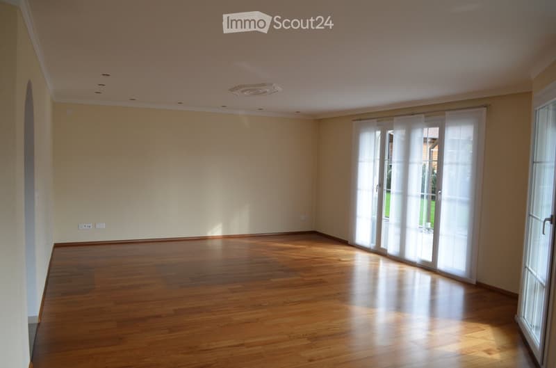 empty room, wooden floor, sliding glass doors, white walls, ceiling lights