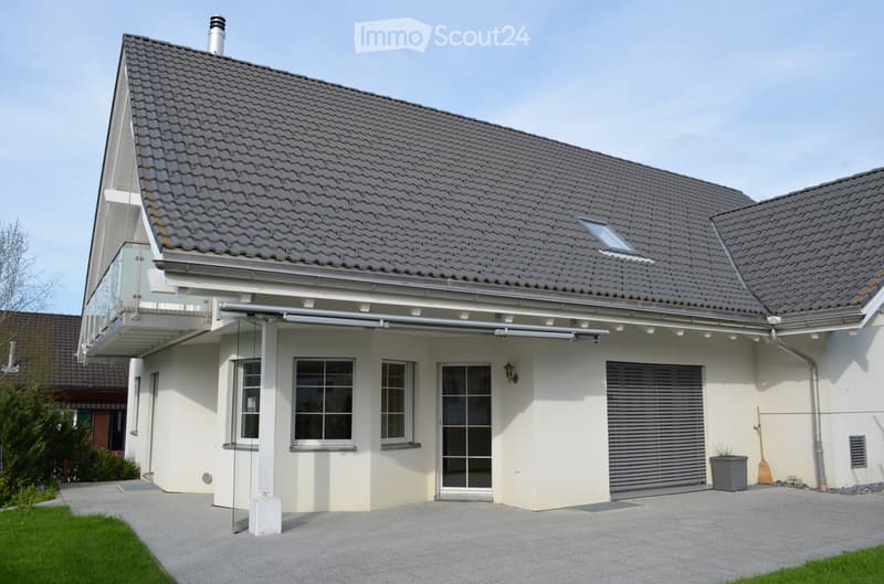 modern white house, gray roof, large windows, glass balcony, garage, driveway