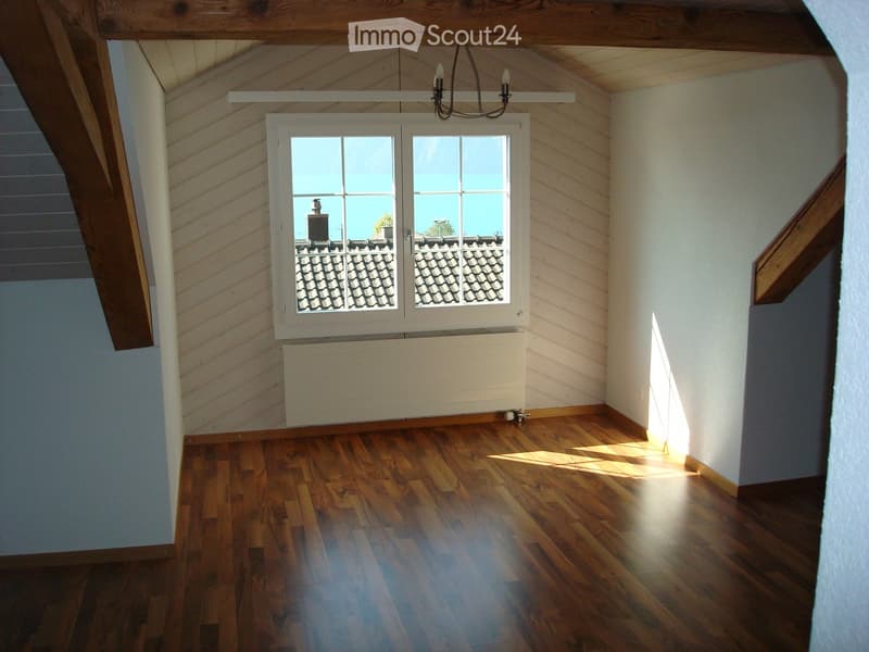 hardwood flooring, white walls, chandelier, window with view