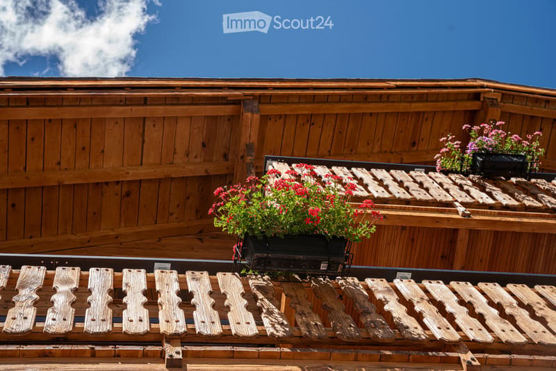 wooden balcony with flower boxes