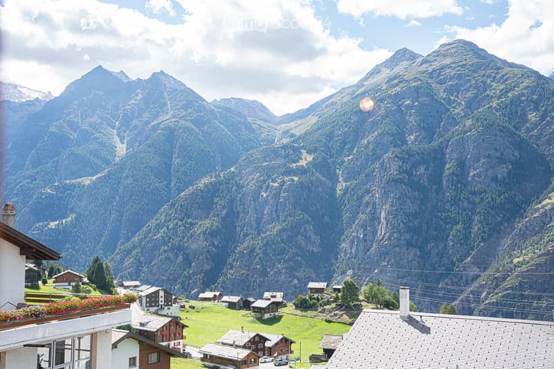 Mountain view, small village, wooden houses, green grass, mountains