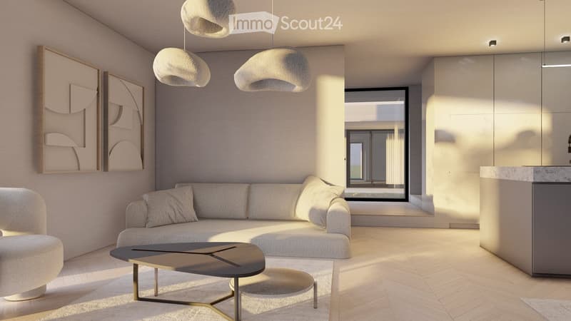 Spacious living room with large windows, beige sofa, coffee table, and abstract art on the walls. Pendant lighting fixtures hang from the ceiling. The room has a minimalist and modern design aesthetic.