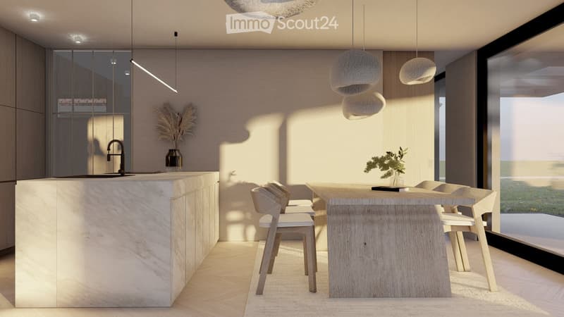 The image shows an open-concept kitchen and dining area with a modern, minimalist design. The kitchen features a large marble island with a black faucet, and the dining area has a wooden table with chairs. The room is illuminated by pendant lights and has