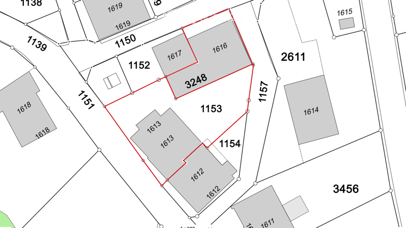 Floor plan showing multiple lots with numbered designations and property boundaries outlined in red.