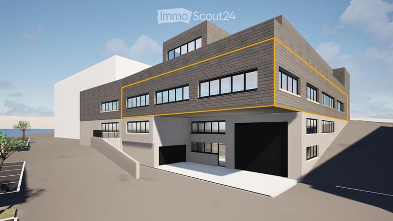 Modern multi-story building with a combination of grey and white exterior, large windows, and a prominent garage entrance.