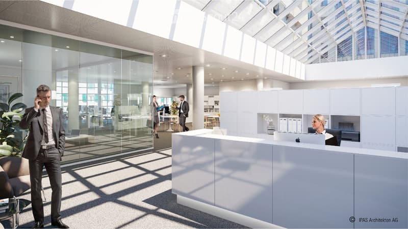 Modern office space with a reception desk, glass walls, and open-plan workstations. Features include a reception area with a laptop, a man on the phone, and several employees working at desks.