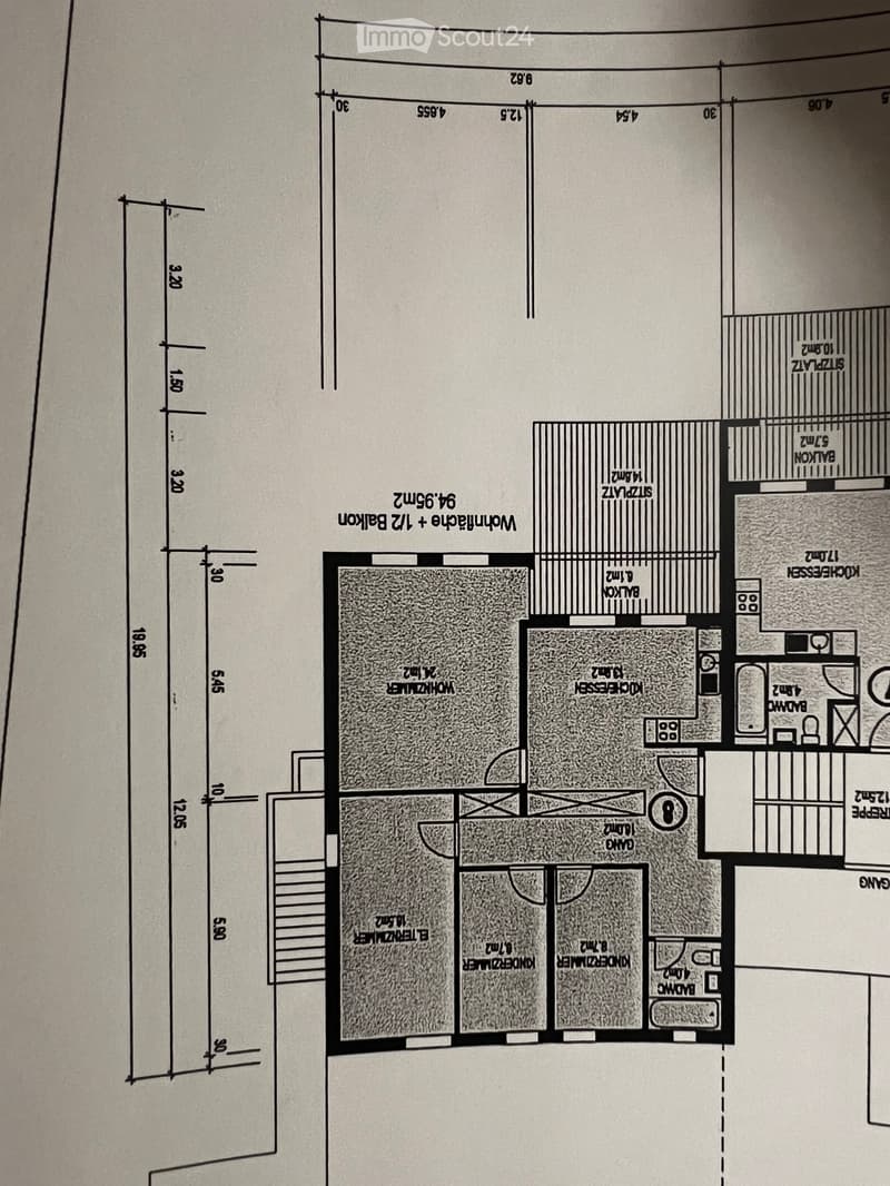 Floor plan showing a layout with multiple rooms including a living room, dining room, kitchen, bedrooms, bathrooms, and a balcony.
