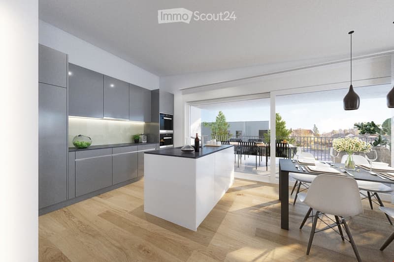 Modern kitchen with grey cabinets, white island, dining area, and large windows overlooking a balcony.