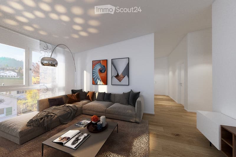 Modern living room with a large sectional sofa, coffee table, floor lamp, artwork on the wall, and a view of the outdoors through large windows.