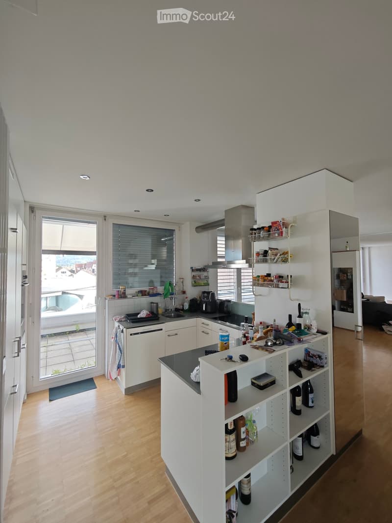 {"type": "Kitchen", "objects": ["sink", "fridge", "dishwasher", "coffee maker", "cupboard", "bottle", "faucet", "bottle rack", "cupboard", "bottle", "bottle", "bottle", "bottle", "bottle", "bottle", "bottle", "bottle", "bottle", "bottle", "bottle", "bottl
