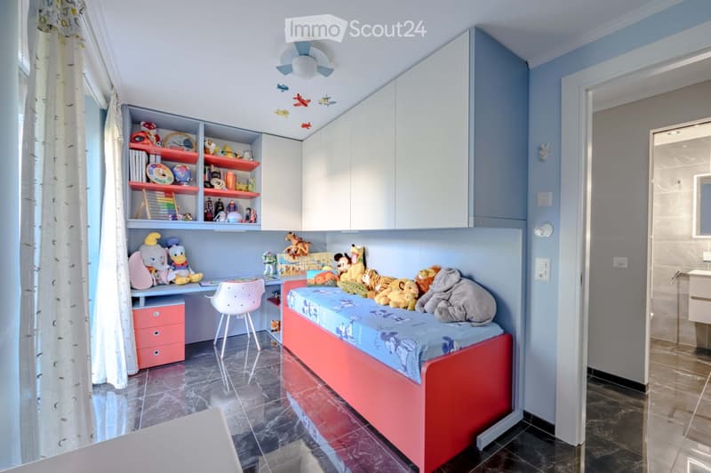 Other. {"visible_features":[],"type":"Furnished Room","objects":["bed","desk","chair","cabinet","toys","stuffed animals","lamp","curtain","tiled floor","sink","toilet","shower area","ceiling fan","ceiling lamp","airplane toys","books","clock","globe","aba