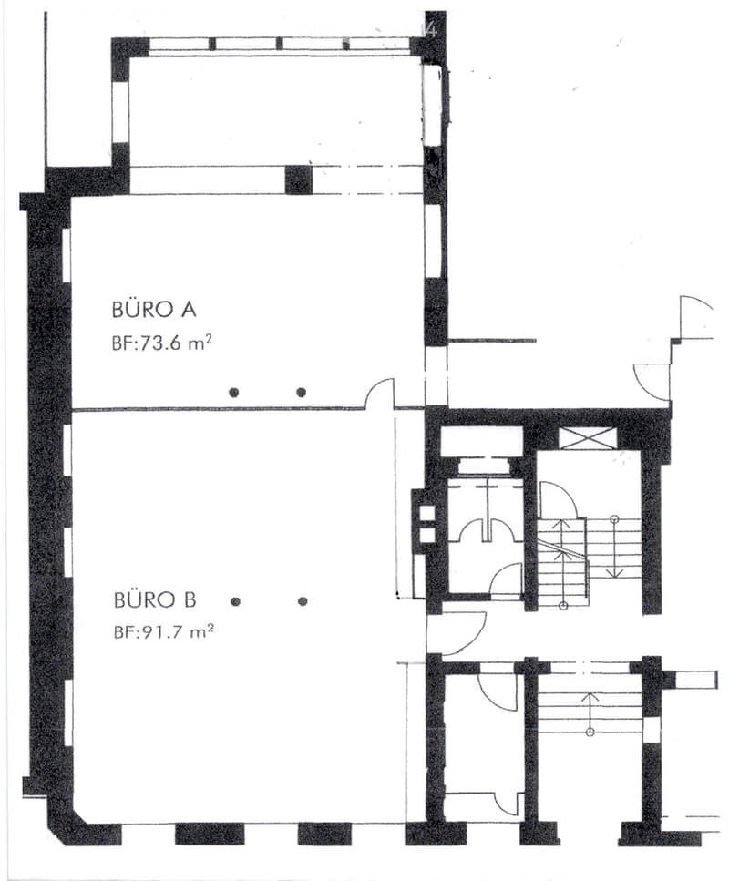 Floor plan showing two office spaces labeled BÜRO A (73.6 m²) and BÜRO B (91.7 m²) with a shared hallway and a small utility area.