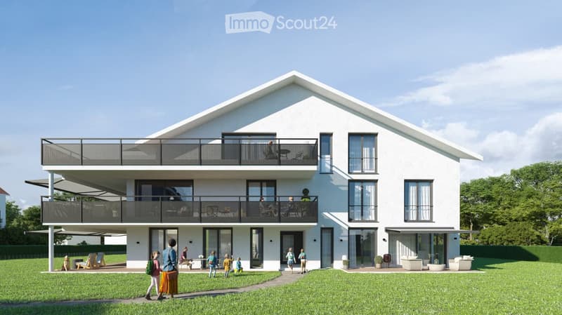 Modern two-story house with white exterior, large windows, and balconies on both levels. The house features a spacious lawn and patio area with outdoor furniture.