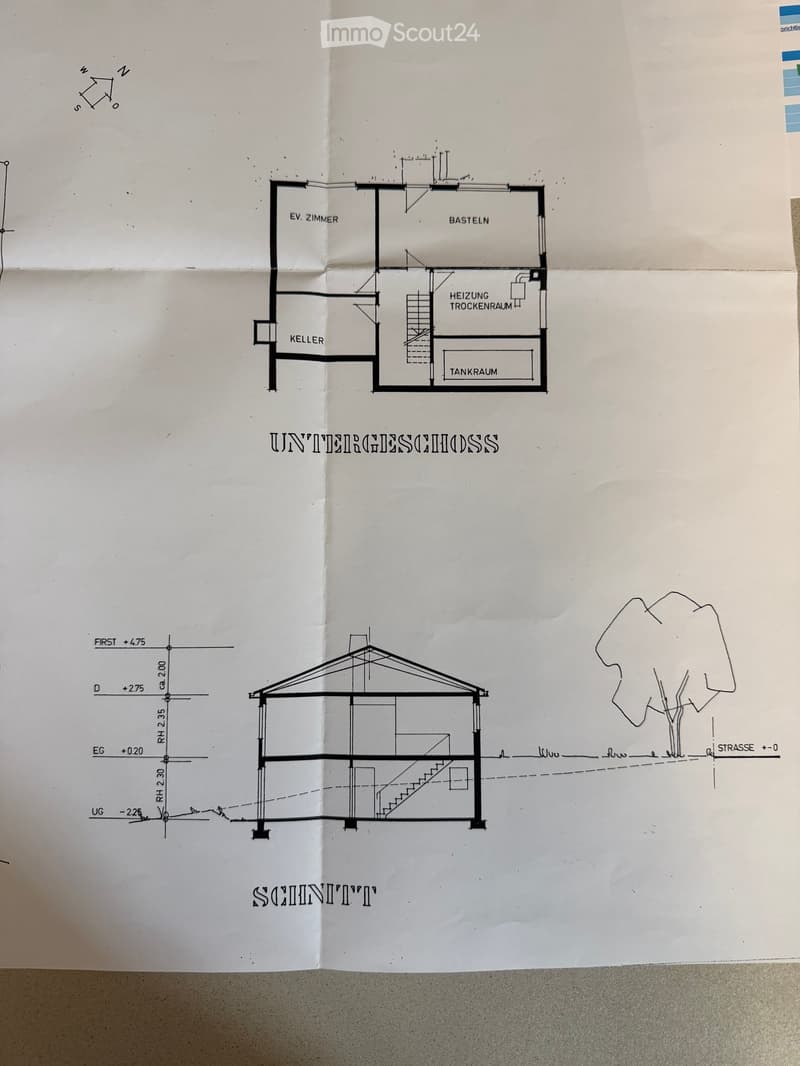 Floor plan of a basement level showing rooms labeled 'EV. ZIMMER', 'BASTELN', 'HEIZUNG TROCKENRAUM', 'TANKRAUM', and 'KELLER'. Includes a staircase and structural details.