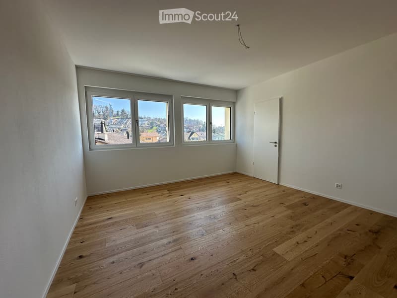 empty room, wooden floor, white walls, three windows, door