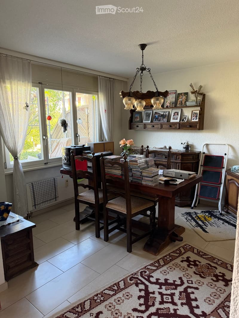 {"type": "Furnished Room", "objects": ["dining table", "chair", "curtain", "cabinet", "picture frame", "chandelier", "laptop", "radiator", "table", "chair", "laptop", "table", "chair", "table", "chair", "table", "chair", "table", "chair", "table", "chair"