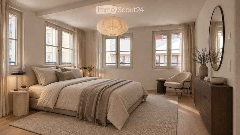 Modern, minimalist bedroom with a large bed, nightstand, armchair, mirror, and decorative items.