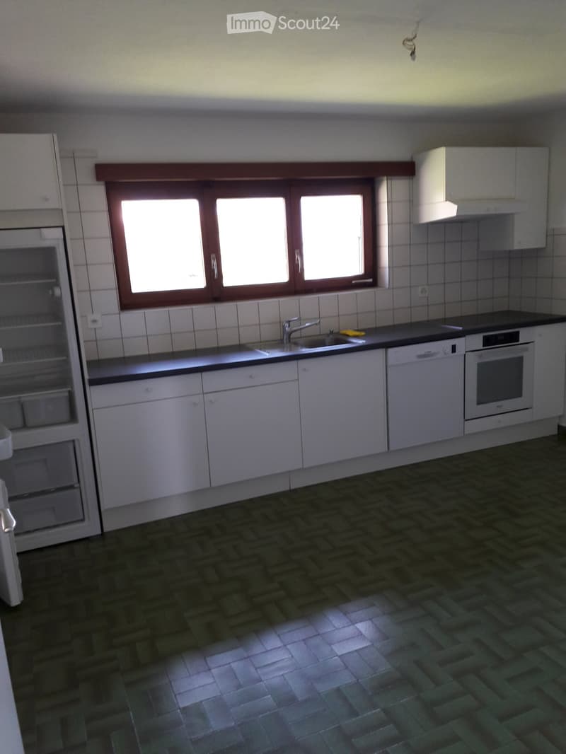 modern kitchen, white cabinets, black countertop, white appliances, window
