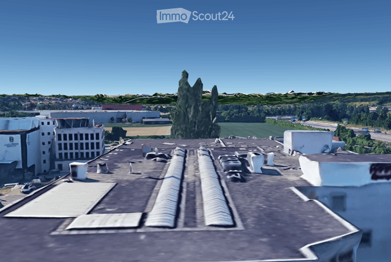 Building rooftop, gray roof, some ventilation pipes, visible chimneys, solar panels