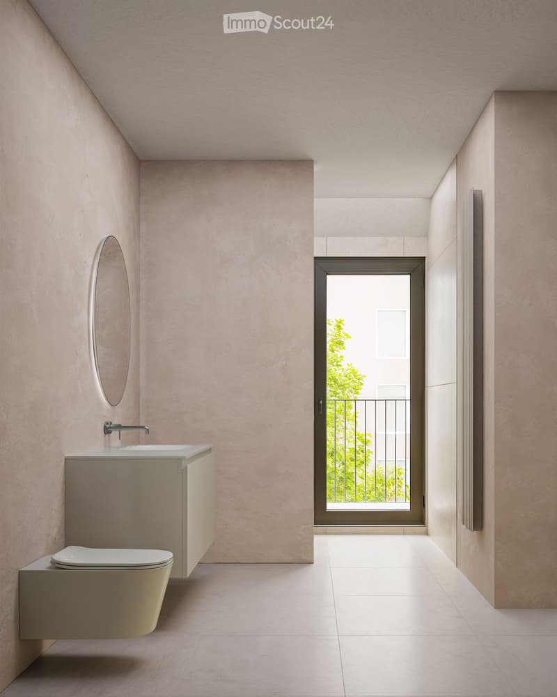 Modern bathroom with beige walls, white floor tiles, round mirror, white sink, and a white toilet.