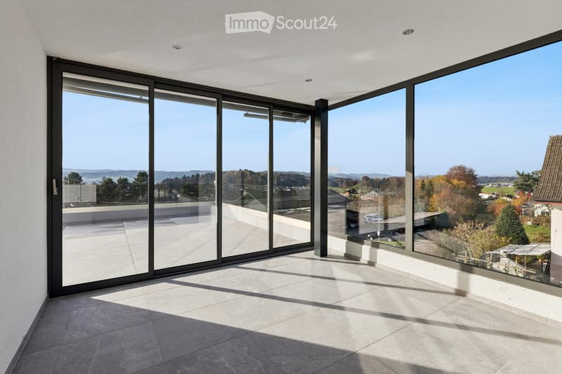 modern room with panoramic windows, black sliding glass doors, tiled floor, large open space