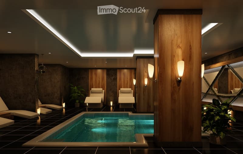Spa area with indoor pool, lounge chairs, and ambient lighting.