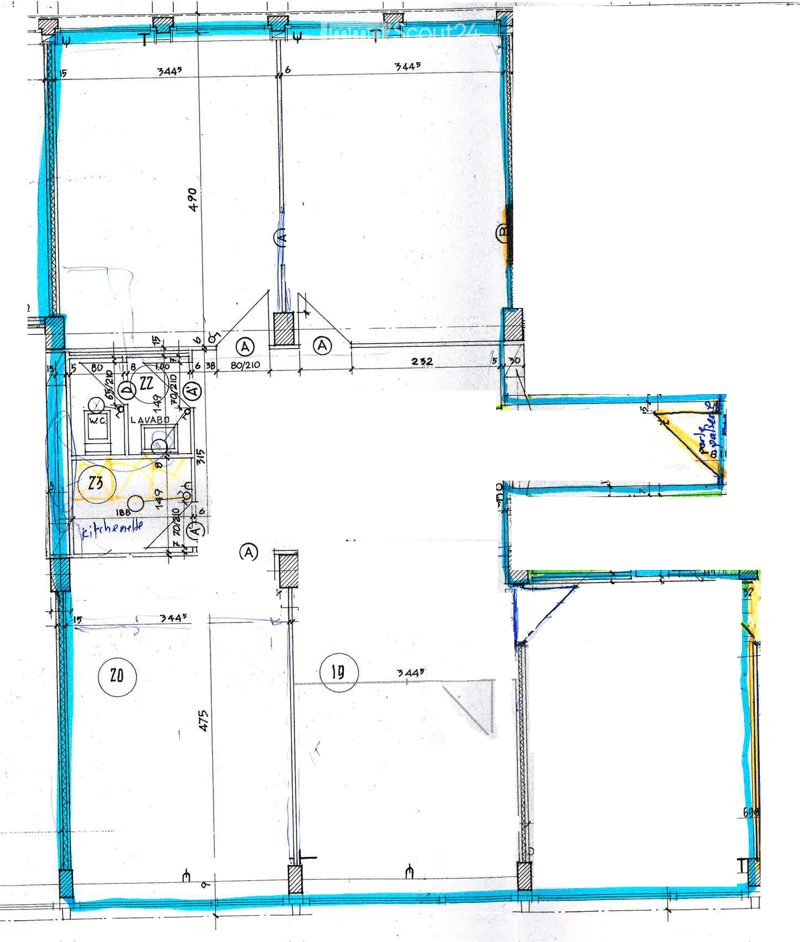 Floor plan showing a kitchen area, a bathroom, and a large open space. Dimensions and labels are marked throughout the layout.