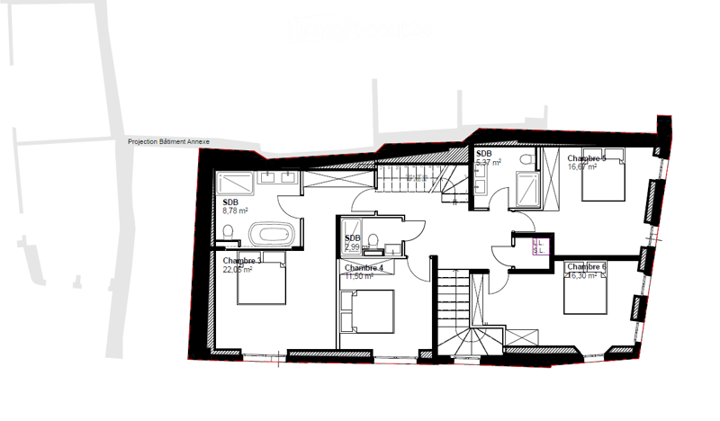 Floor plan of a building with multiple rooms including bedrooms, bathrooms, and an annex building projection.