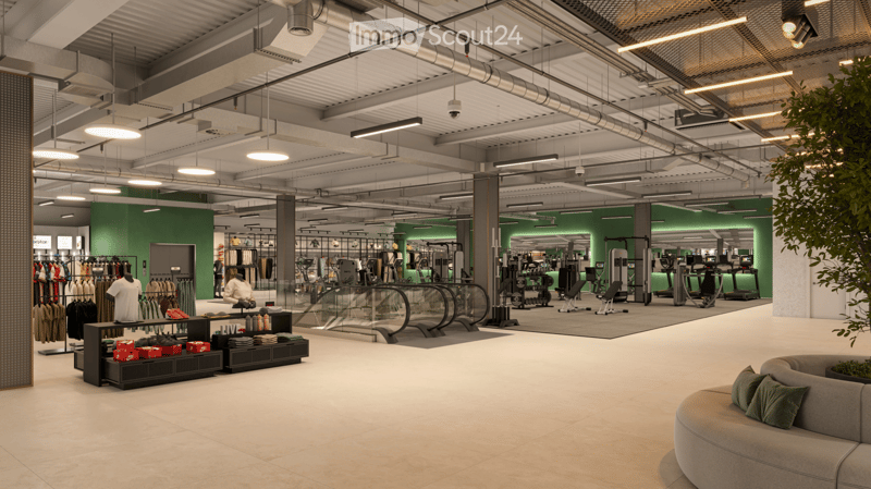 Modern, spacious retail or fitness space with a mix of furniture and exercise equipment. Features a large sofa, shelves with clothing and accessories, and various fitness machines.