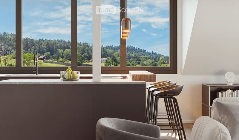 Modern kitchen with a large window overlooking a scenic landscape, featuring a dark countertop, stools, a sink, and a bowl of fruit.