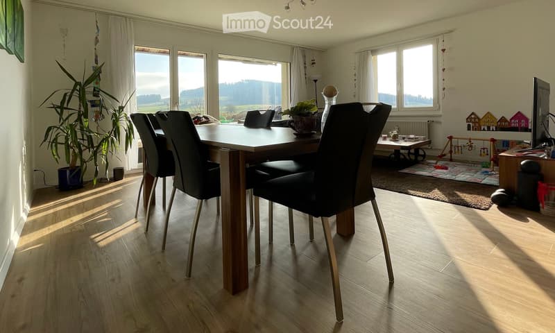 dining room, wooden floor, dining table, chairs, large windows, white curtains, potted plants, view of landscape