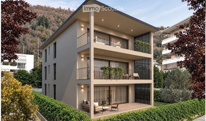 Modern three-story residential building with balconies, large windows, and contemporary design, surrounded by greenery and trees.