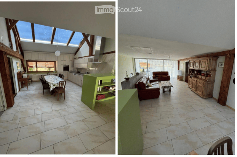 The image shows two connected rooms: a dining area with a round table and chairs, and a living area with a red sofa, coffee table, and wooden cabinetry. The dining area features a green bookshelf and a modern kitchen with white cabinets and stainless stee