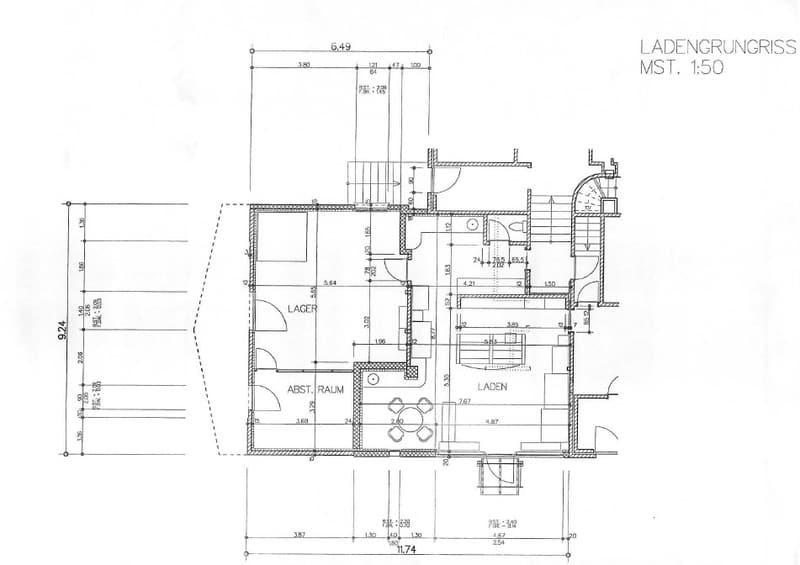 Floor plan of a basement level showing a storage area, workshop, and utility room with labeled dimensions and measurements.