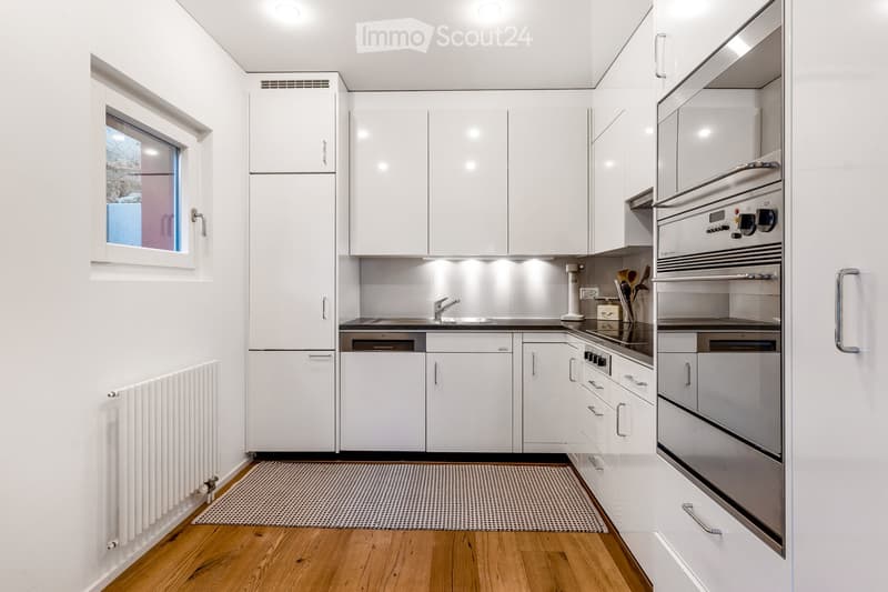 all white kitchen, wooden floor, modern appliances, dishwasher, window