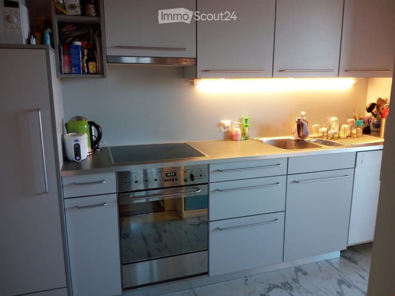 {"type": "Kitchen", "objects": ["oven", "induction cooktop", "sink", "faucet", "cupboard", "refrigerator", "microwave", "keypad", "cupboard", "cupboard", "cupboard", "cupboard", "cupboard", "cupboard", "cupboard", "cupboard", "cupboard", "cupboard", "cupb