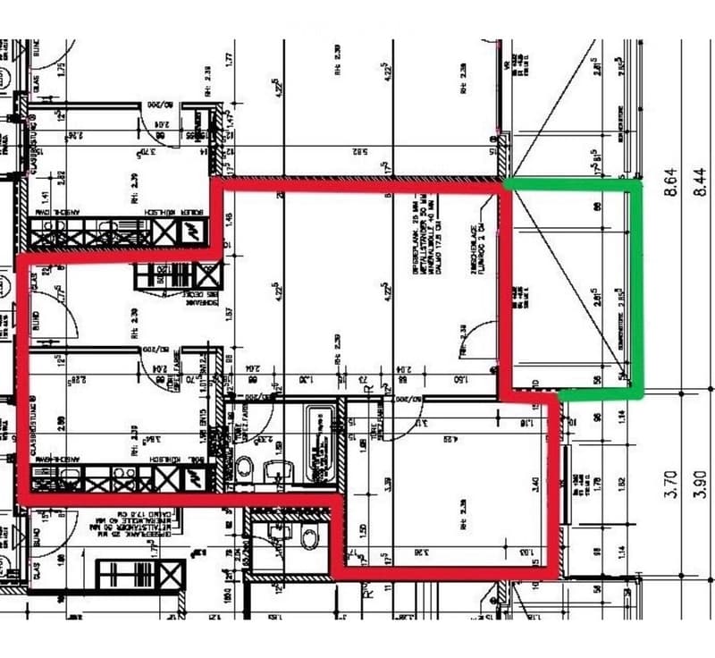 Floor plan of a residential building showing multiple rooms, including living areas, bedrooms, and bathrooms, with labeled dimensions and room numbers.