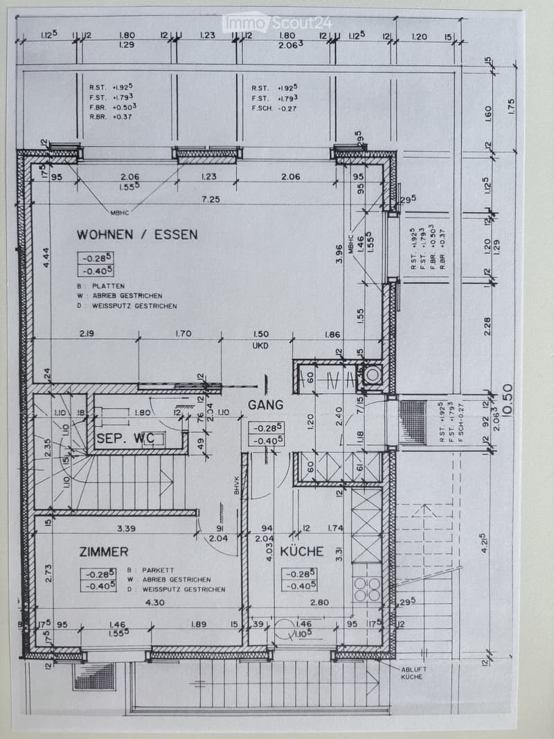 Floor plan showing a living/dining area, hallway, separate WC, bedroom, and kitchen with labeled dimensions and floor types.