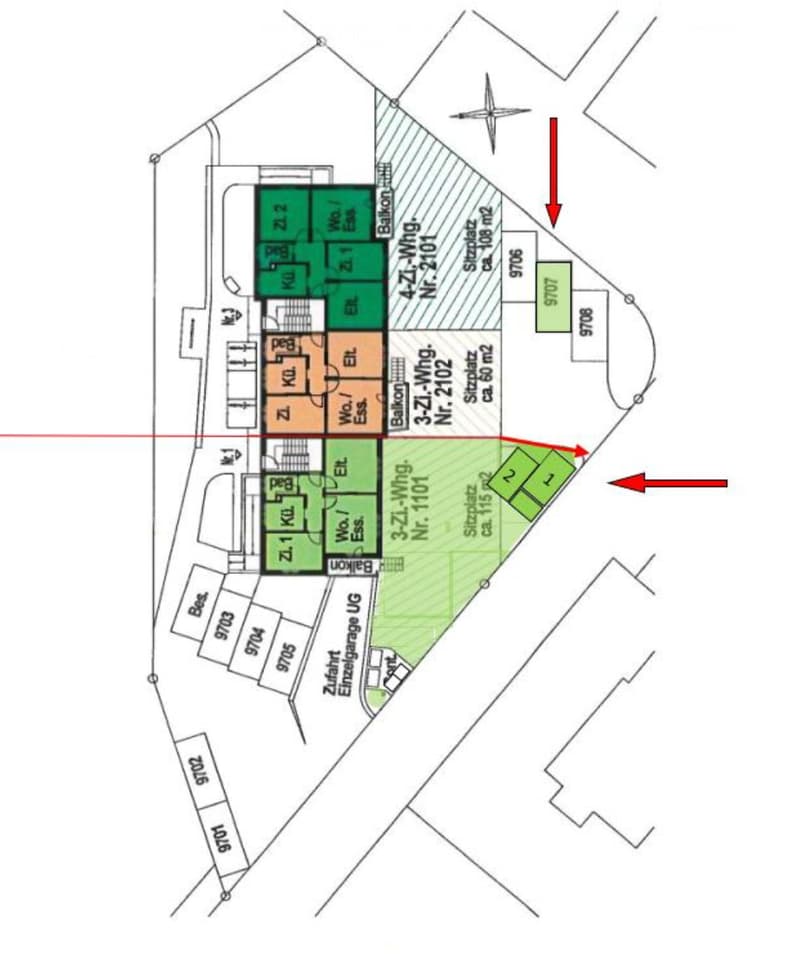 Floor plan showing multiple apartments, including living rooms, kitchens, bedrooms, and bathrooms, with a shared balcony and garage access.
