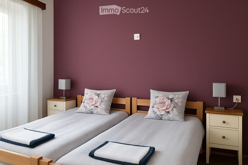 Cozy bedroom with two single beds, matching nightstands, lamps, and decorative pillows.